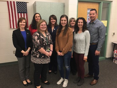 Taylor Brown, center, celebrates Lights, Camera, Save! third-place win with parents, Central Dauphin business teacher, and Centric Bank team.