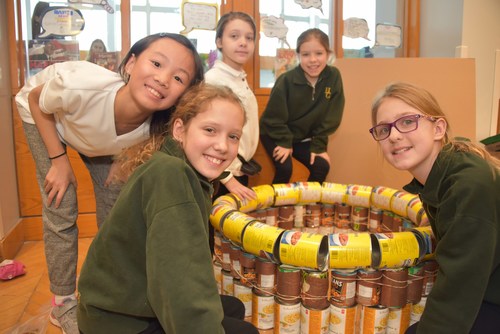 This past Wednesday, February 27, Grade 5 students at Havergal College built structures out of canned and packaged food items, which will be donated to the North York Harvest Food Bank. Inspired by international, non-profit design and build competition Canstruction, the project aims to decrease hunger and fight poverty in the North Toronto community. (CNW Group/Havergal College)