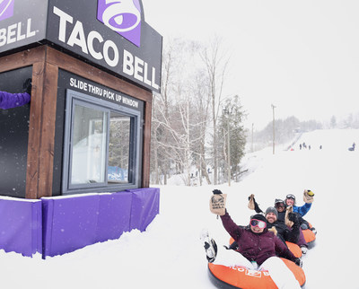 Taco Bell fans will test the world's first "slide-thru" takeout window - ordering Taco Bell at the top of a snow tubing hill and collecting it at the bottom (CNW Group/Taco Bell Canada)