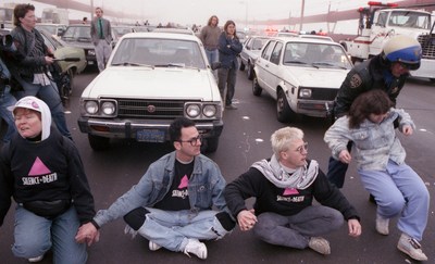 Photograph of Stop AIDS Now or Else (SANOE) protesters blocking the Golden Gate Bridge, Rick Gerharter, Photograph of Stop AIDS Now or Else (SANOE) protesters blocking the Golden Gate Bridge, 1989. Photograph
