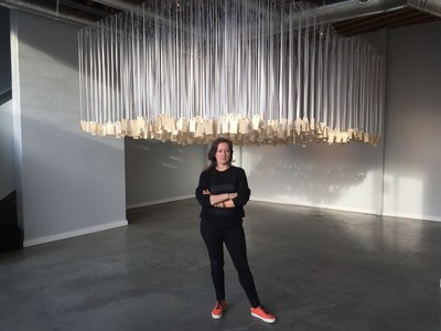 Ann Lewis with her installation, ...and counting, in Emerging Collective's new art space in Decatur, Atlanta.