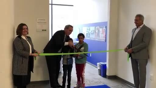 H.B. Fuller CEO Jim Owens and students from Bancroft Elementary officially open the company's JA BizTown Innovation Center.