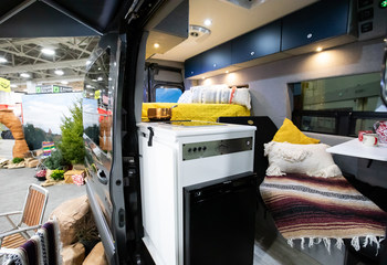The interior of the all new Storyteller Overland MODE 4x4 shown here on the Ford Transit platform in the Van Life Vignette at the recent RVX Expo in Salt Lake City, Utah.