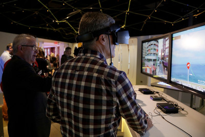 Guests take part in a virtual reality 5G demonstration at the Sprint 5G Experience.