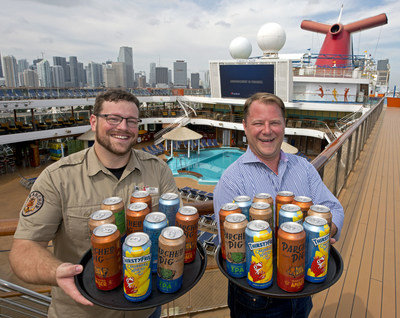 Colin Presby, left, Carnival Cruise Line's brewmaster, and Edward Allen, right, Carnival's vice president of beverage operations show trays of the line's new craft beer cans aboard Carnival Magic Sunday, March 17, 2019, at PortMiami. The line has partnered with Lakeland, Fla.-based Brew Hub to become the first cruise line to can and keg its own private label beers, first created by its in-house brewery team aboard Carnival Vista and Carnival Horizon. The beers include ThirstyFrog Caribbean Wheat, ParchedPig West Coast IPA and ParchedPig Toasted Amber Ale. (Photo by Andy Newman/Carnival Cruise Line)