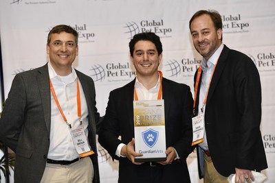 John Dillon (center), founder of GuardianVets and grand prize winner of the 2019 Pet Care Innovation Prize, accepts his award at Global Pet Expo in Orlando on March 21, 2019 from Bill Broun (left) and David Narkiewicz (right) from Purina. The Pet Care Innovation Prize is a collaborative effort of Purina’s 9 Square Ventures division with investing leaders, Active Capital, to support and connect with early stage pet care startups.
