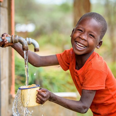 6-year-old Cheru Lotuliapus celebrates the change in her community now that clean water is available just a short walk away. Her village in Kenya recently received the water access through World Vision. Credit: World Vision