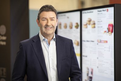 McDonald’s President and Chief Executive Officer Steve Easterbrook pictured in front of a drive-thru digital menu board, which will utilize Dynamic Yield’s decision logic technology to enhance the customer experience.