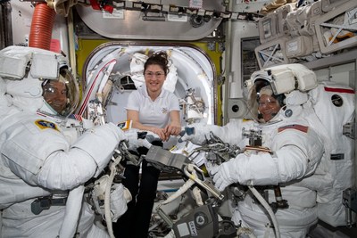 NASA astronaut Christina Koch (center) assists fellow astronauts Nick Hague (left) and Anne McClain in their U.S. spacesuits shortly before they begin the first spacewalk of their careers. Hague and McClain worked outside, in the vacuum of space, for six hours and 39 minutes on March 22, 2019, to upgrade the International Space Station's power storage capacity. Image credit: NASA
