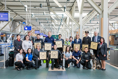 Craig Richmond, President & CEO, Vancouver Airport Authority, celebrates Vancouver International Airport (YVR) being named Best Airport in North America for a record 10 consecutive years with partners from across Sea Island. 24,000 employees work on Sea Island, featured in the photo include employees from Air Canada, WestJet, U.S. Customers and Border Protection, Dexterra, BC Ambulance Service, Securiguard, Fairmont Vancouver Airport and Vancouver Airport Authority. (CNW Group/Vancouver Airport Authority)