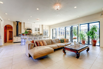 Clean, bright interiors define the main residence. The living room is located just off the kitchen, which includes top-of-the-line appliances. WashingtonLuxuryAuction.com.