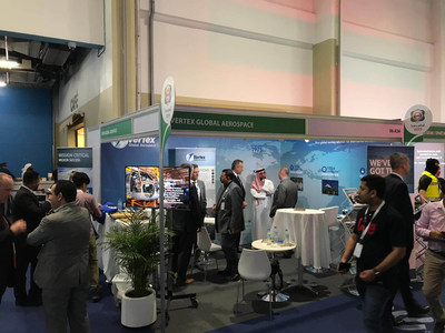 Members of the Vertex Global Aerospace business line visit with guests while exhibiting at the International Defence Exhibition and Conference in Abu Dhabi, United Arab Emirates, February 17, 2019. Vertex Aerospace opened a headquarters office in Abu Dhabi in March that will be run by its recently established VGA business line. Courtesy Photo.