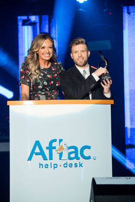 ACM nominee Carly Pearce presents Aflac ACM Lifting Lives Honor recipient Brandon Ray with his trophy in Las Vegas on April 5, 2019, in advance of the 54th Academy of Country Music Awards®.