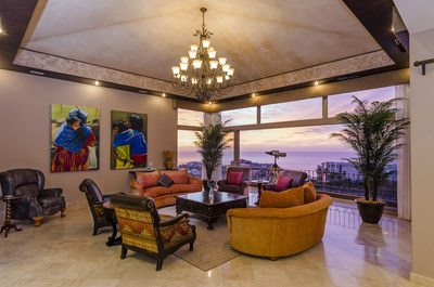 A comfortable salon offers panoramic ocean and sunset views. CaboLuxuryAuction.com