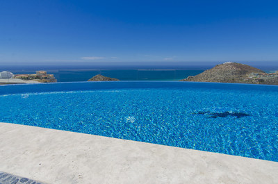 The infinity-edge pool appears to spill right into the sparkling Pacific. CaboLuxuryAuction.com.