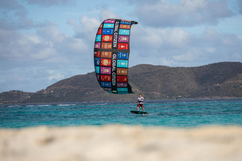 World Champion Nick Jakobsen rides the "Global Citizen" kite on Sir Richard Branson's Necker Island in support of World Identity Network (WIN), ACTAI Global and Global Citizen Forum. Photo credit: Jussi Oksanen