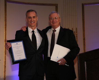 President and General Manager of Almirall LLC, Ron Menezes (left), receiving his award from the President of the Board of Directors for the American Skin Association, Dr. David Norris.