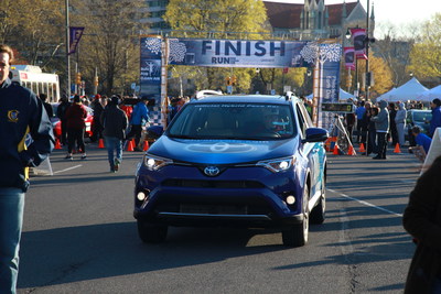 Toyota Hybrids' pace vehicle leads runners to the finish of Clean Air Council's Run for Clean Air.