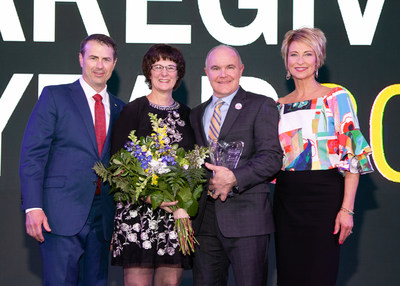2019 North American CAREGiver of the Year, Barb Hoffman, joined by Home Instead Senior Care co-founders Paul and Lori Hogan and franchise owner Jason Crane on-stage at the annual awards ceremony in Omaha, Neb. on April 24, 2019.