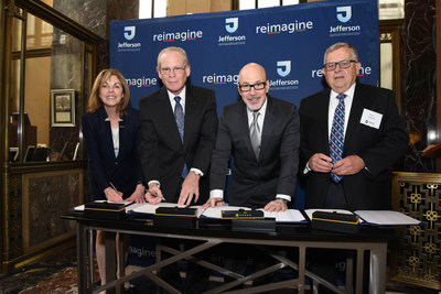 Elizabeth Dale, EdD; Larry Merlis; Stephen Klasko, MD, MBA; and Barry Lambert pose for a photograph during an official signing ceremony at Jefferson.