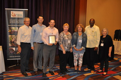 Voyager RV Resort Manager, Geoffrey Campbell presented with the 2019 ARVC Mega Park of the Year Award. Colleagues Debby Mitchell, Lisa Glendinning and James Marshall from Voyager are also in attendance. Representatives from AZ ARVC are Co-Executive Directors Dave Schenck and JoAnn Mickelson along with John Sheedy, President of the Executive Committee for AZ ARVC.