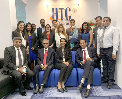 Chary Mudumby, Teja Reddy, Saji Abraham (seated) with HTC Global Services Malaysia Team