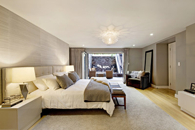 The spacious master suite opens to the lower terrace, where features such as a rock garden, lounge seating and a fully-equipped outdoor kitchen – in addition to “waterfall” and “putting green” amenities – await. NewYorkLuxuryAuction.com