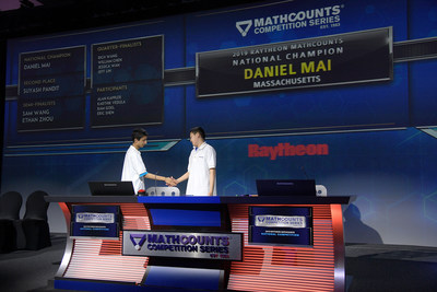 2019 Raytheon MATHCOUNTS National Competition winner Daniel Mai, right, shakes hands with runner-up Suyash Pandit after winning Monday, May 13, 2019, in Orlando, Fla. (Phelan M. Ebenhack for The Raytheon Company)