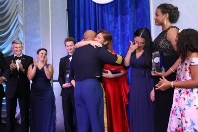 Jaysha Young is surprised by her deployed father Sergeant Major Jamall Young who joined her on stage as she received her Military Hero Award
