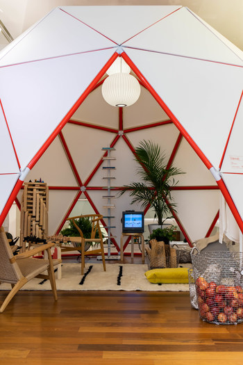 Dome Life is an homage to the geodesic dome. Dome Home (shown) houses a uniform of essential white basics from Entireworld as well as classics from Hans Wegner, George Nelson and Alvar Aalto alongside a Buckminster Fuller library. Photo by Alexander Kusak.