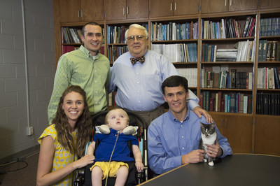 Auburn scientists developed a gene therapy treatment for GM1 gangliosidosis that is in clinical trials at the National Institutes of Health. Sara and Michael Heatherly of Opelika, Alabama, whose son Porter was the first known case of GM1 in Alabama and died in 2016, have been instrumental in bringing awareness to the disease. Pictured in a 2014 photo are Sara and Porter Heatherly, Dr. Doug Martin, Michael Heatherly and Dr. Henry Baker, director emeritus of Auburn's Scott-Ritchey Research Center.