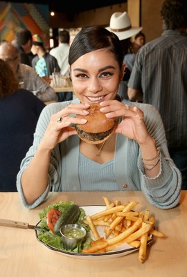 Actress Vanessa Hudgens enjoys a Vegan Burger at the opening celebration of Black Tap Craft Burgers &amp; Shakes, May 18, 2019, in the Downtown Disney District at Disneyland Resort in Anaheim, Calif. (Photo by Jesse Grant/Getty Images for Black Tap Craft Burgers and Shakes)