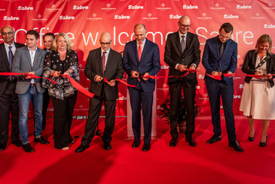 Key Sabre executives were present for a ribbon-cutting ceremony at the site that will house Sabre Poland's new global development center location. Among those pictured are Sundar Narasimhan, SVP and president of Sabre Labs and product strategy (far left); Louis Selincourt, SVP, global development centers (fifth from left); Sean Menke, president and CEO (fourth from right); and Sebastian Drzewieckit, vice president and managing director of the Poland development center (third from right).