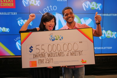 OLG’s VP Channel Management, Debora Hume, celebrates a $55 million win with Dwayne Williams from Whitby. Dwayne won the April 5, 2019 LOTTO MAX jackpot. (CNW Group/OLG Winners)