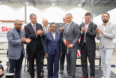 Chicago Mayor Lori Lightfoot and Skender CEO Mark Skender cut the ribbon to officially open Skender's manufacturing facility on the southwest side of Chicago, which will produce modular affordable housing for the city. Pictured left to right: 27th Ward Alderman Walter Burnett; Gary Perinar, Chicago Regional Council of Carpenters; 22nd Ward Alderman Michael Rodriguez; Mayor Lightfoot; Pete Murray, Skender; Mark Skender; Andy Gloor, Sterling Bay; Tim Swanson, Skender.