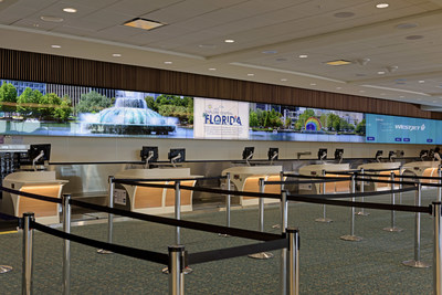 A total of 700 LG 55-inch ultra-thin-bezel videowall screens were installed at the airport to create a continuous 1,561-foot digital display wall behind airline counters.