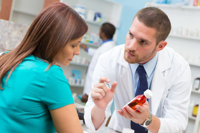 Pharmacist consults with patient about new prescription medication