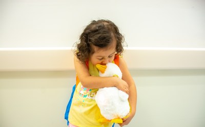 Sophia Zuniga, a three-year old cancer patient, kisses her new My Special Aflac Duck, a robotic companion designed to comfort her and other pediatric cancer patients throughout their treatment, after receiving this special gift at CHOC Children's Hospital in Orange, Calif. on Wednesday, June 5, 2019.
