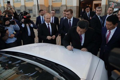 In the Front of Kremlin. China President Jinping Xi and Russian President Vladimir Putin Sign the Autographs on a Haval F7.