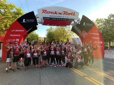 St. Jude Heroes unite at the start line of the 2019 St. Jude Rock 'n' Roll Seattle Marathon & ½ Marathon to celebrate raising $300,000 for the hospital. Credit: ALSAC/St. Jude Children's Research Hospital.