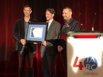 Dr. Christopher Mackie (centre) is presented the 2019 IABC London Outstanding Communicator Award at the chapter's 40th anniversary celebration on June 6. Presenting the award are 2017 Outstanding Communicator Award winner Andrew McLenaghan (left) and IABC London chapter president Andrew Kaszowski (right). (CNW Group/IABC London)