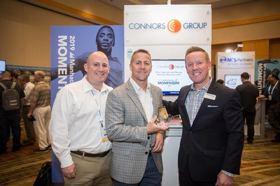 Shawn Roche (left) and Jon Huesdash (center) from Connors Group receiving the Innovator of the Year award from Eric Lamphier of Manhattan Associates at the recent Momentum conference in Phoenix, Arizona.