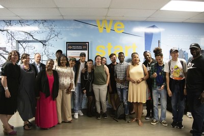 TRIPOD at Writers Room community and student participants pose for a photo in front of mural printed on the Océ Colorado 1640 and installed in front of Drexel University’s English Department.