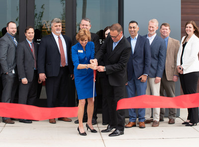 Gurnee Mayor Kristina Kovarik and ALEC President/CEO Joseph Trosclair cut the ribbon to celebrate the opening of ALEC's new corporate headquarters and Member Service Center.