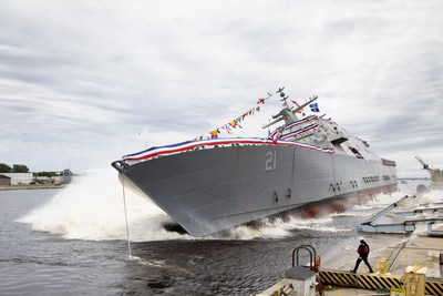 The 21st Littoral Combat Ship, the future USS Minneapolis-Saint Paul, launches sideways into the Menominee River in Marinette, Wisconsin, on June 15.