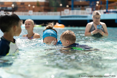 A swim instructor at World Waterpark, West Edmonton, Canada, helps a young swimmer practice how to blow bubbles and breathe during the World’s Largest Swimming Lesson.  The 24-hour global event spreads the message "Swimming Lessons Save Lives" to families in 30 different countries to help prevent drowning. The World Health Organization (WHO) estimates drowning is the 3rd leading cause of unintentional injury death worldwide, accounting for 7% of all injury-related deaths.