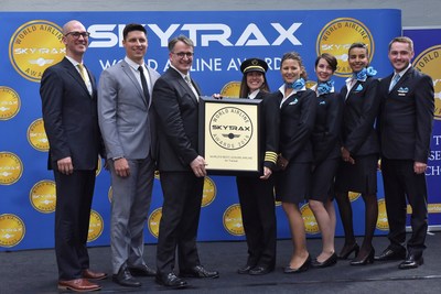 Left to right : Dave Bourdages, Vice-President, In-Flight Services and Customer Experience, Simon Rochette, Manager, In-Flight Experience and commissary, Jean-François Lemay, President, Martine Olivier, Captain A330, Karina Comlekcioglu, Security Officer, Émilie Lamborelle and Hajar Hannouni, Flight Attendants, Nicolas Demers, Performance Manager, In-Flight Service (CNW Group/Transat A.T. Inc.)