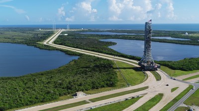 This aerial view shows NASA's mobile launcher atop crawler-transporter 2 as it moves along the crawlerway, making its way to Launch Pad 39B at the agency's Kennedy Space Center in Florida. Credits: NASA