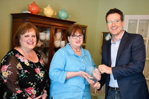 OnDeck CEO Noah Breslow joins Tea By Two co-owners Janet Meyers (l) and Erin Bradley (c) to celebrate the success of their small business in Bel Air, Maryland.