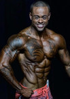 Mon Ethos Pro President David Whitaker signs IFBB Pro Bodybuilder Kai Spencer ahead of his upcoming competition at the Battle in the Desert on June 29